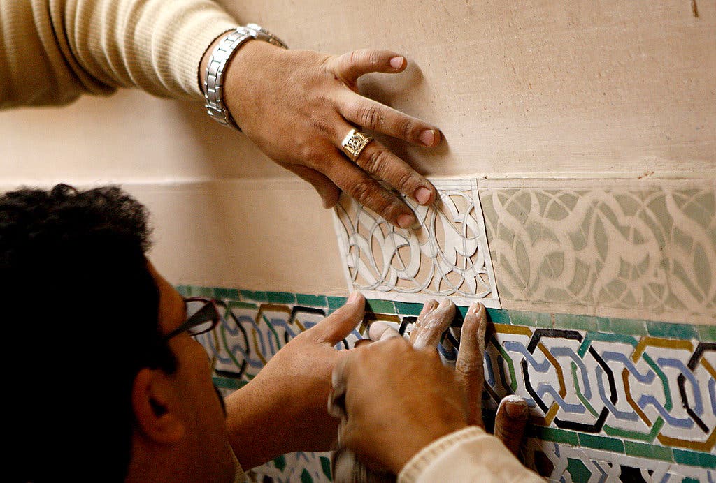 Craftsmen fitting plaster panels